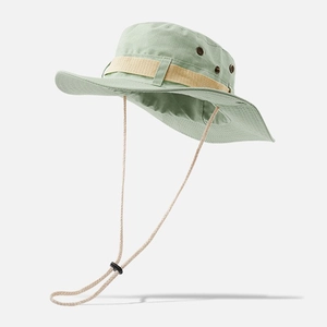 Detail of light green wide brim boonie hat featuring breathable eyelets and wind cord
