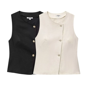 Detailed texture of linen-blend double-breasted vest tops in black and cream beige