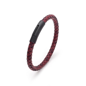 Detail shot of red braided leather bracelet featuring a black magnetic metal clasp