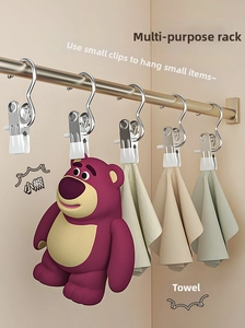 Close-up of stainless steel S-shaped multi-purpose hanging clips for laundry and storage
