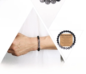 Detail of 80th birthday gift bracelet with natural map stones and meaningful message card