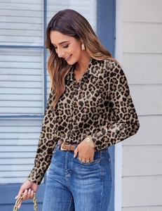 Detail of leopard print long sleeve shirt with button-down collar and slim fit tailoring