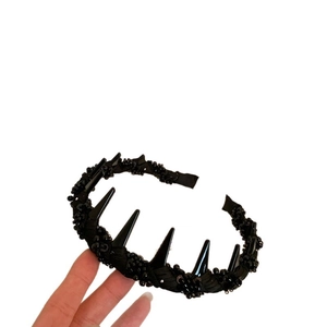 Punk style black spiked headband with beaded mesh detailing for women’s hair
