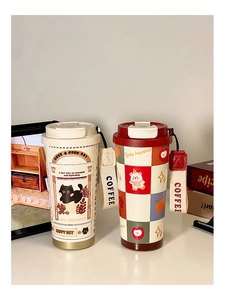 Detail of insulated coffee mugs with woven straps and Have a Good Day typography