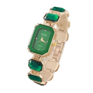 Elegant gold quartz watch for women with emerald green octagon crystals and stone dial