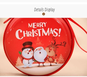Macro shot of red tin Christmas coin purse with zipper and cartoon snowman patterns