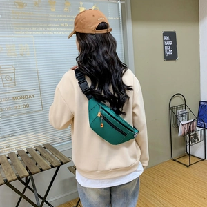 Dark green oxford waist bag with adjustable strap and orange zipper pulls for outdoor sport