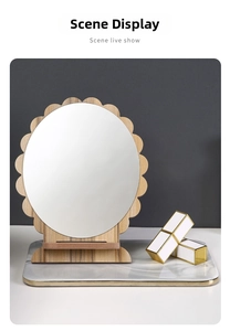 Close-up of minimalist sunflower shaped wooden vanity mirror on marble tray background