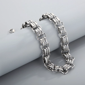 Detailed close-up of 15mm thick silver chain bracelet with textured square links