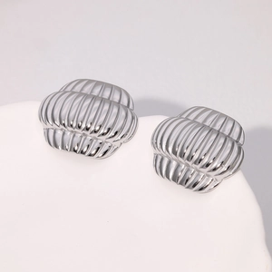 Modern silver lantern earrings with 18k gold plating and textured striped design