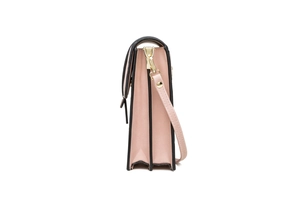 Side view of pink leather mini mobile bag with black edges and gold metal hardware