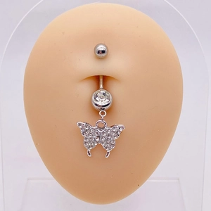 Silver butterfly belly ring with sparkling crystals shown on a skin-tone silicone model