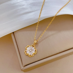 Elegant gold titanium steel necklace featuring a sparkling five-petal zircon flower pendant