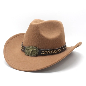 Detail of brown felt cowboy hat featuring black leather band and antique bull head buckle