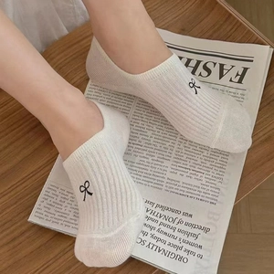 White knit cotton ankle socks with black bow embroidery for women casual athletic wear