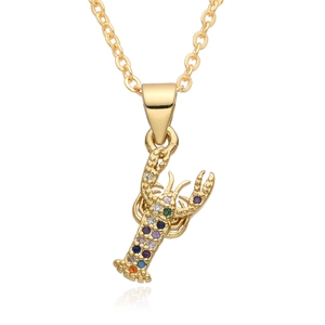 Detailed view of a gold lobster pendant with colorful cubic zirconia on a cable chain