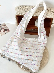 White lace crochet tote bag with colorful gradient stripes and seashell pendants