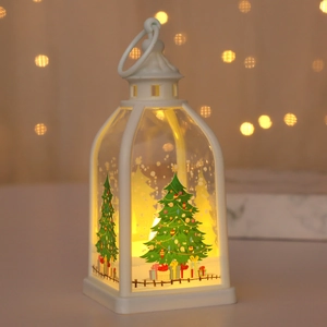 Detail of white Christmas lantern with festive tree pattern and warm LED light effect