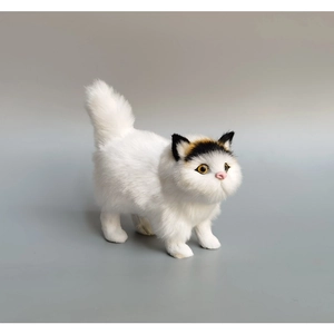 Realistic white and spotted lifelike cat figurine with detailed synthetic fur texture
