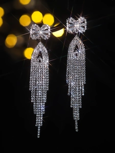 Sparkling long tassel bow earrings with pavé cubic zirconia on a luxury silver base
