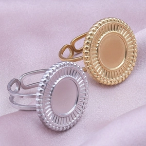 Detailed macro view of adjustable stainless steel ring bases with round bezel and bead edges