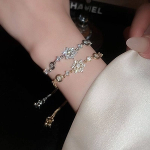Sparkling zircon flower bracelets in gold and silver finish with adjustable sliders