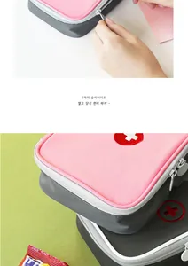 Close-up of a pink travel medical bag showing the dual zipper and durable nylon texture