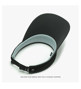 Detail of breathable COOLKNIT mesh lining and adjustable strap on black sun visor hat
