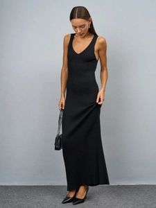 Close-up of elegant V-neckline and fine vertical knit texture on this black slim maxi dress