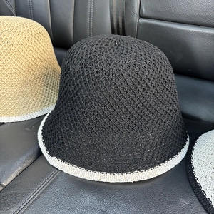Close-up of contrast trim knitted sun hats showing breathable hollow weave texture