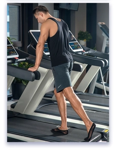 Close-up of black low-cut five-toe socks on a male model in a fitness setting