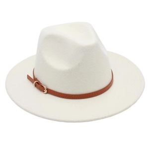 Close-up of beige wool felt fedora featuring a brown leather belt buckle and gold metal pin