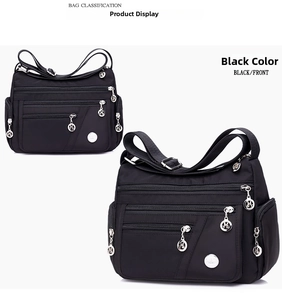 Macro view of black waterproof nylon crossbody bag with multiple silver zipper pockets