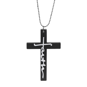 Detail of black wooden cross pendant with white faith engraving on ball chain necklace