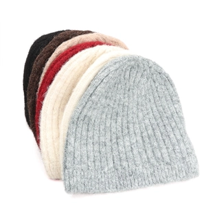 Detailed texture of thick ribbed knit beanies in six assorted autumn winter colors