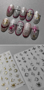 Detail of M-165 3D metallic embossed nail stickers with gold and silver celestial patterns