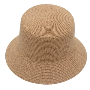 Classic woven straw bucket hat in natural tan with fine texture for sun protection