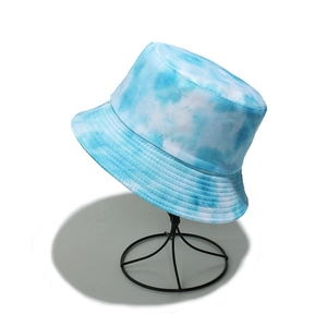 Detail showing the blue and white tie-dye fabric and texture of the summer bucket hat
