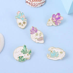 Set of five gothic enamel skull pins with colorful crystals and gold-plated alloy base
