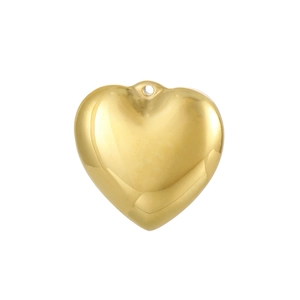 Close-up of a polished golden heart pendant with a small hole for DIY jewelry making