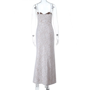 Detailed back view of white lace maxi dress featuring delicate floral embroidery