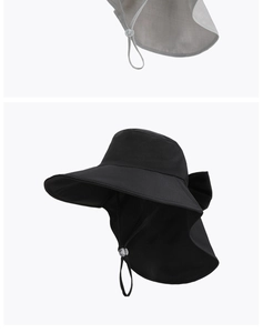 Detail view of the wide brim sun hat with adjustable wind cord and neck protection flap