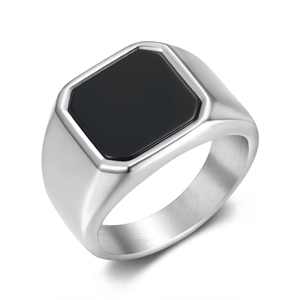 Macro view showing the polished silver ring band and smooth black square stone inlay