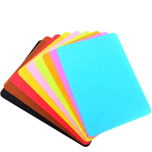 Set of 9 colorful silicone placemats for kids and pets in various bright solid colors