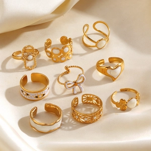 9-piece gold titanium steel ring set with white enamel hearts and floral patterns