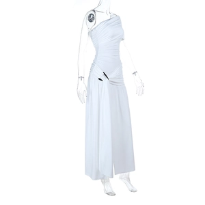 Detail of white one-shoulder maxi dress featuring elegant side ruching and slit design