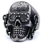 Front view of a punk rock skull ring with goggle and rivet details in retro finish