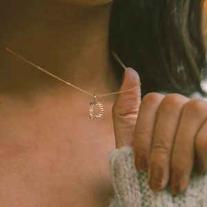 Polished gold letter D initial necklace with ribbed texture on delicate chain