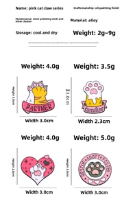Detailed view of pink cat paw enamel badges with sizes and weights on white background