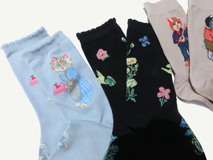 Detailed close-up of colorful animal and floral jacquard patterns on women's cotton socks